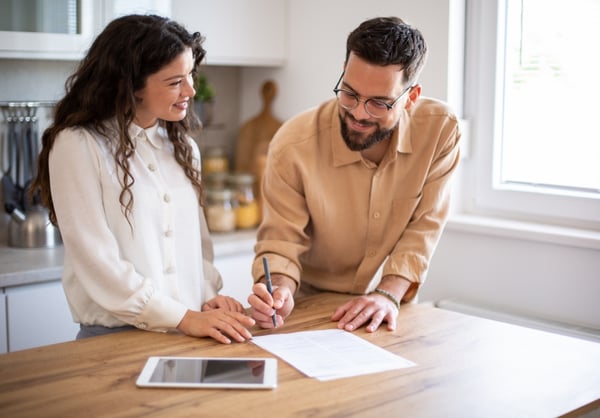 A couple in the kitchen financial planning