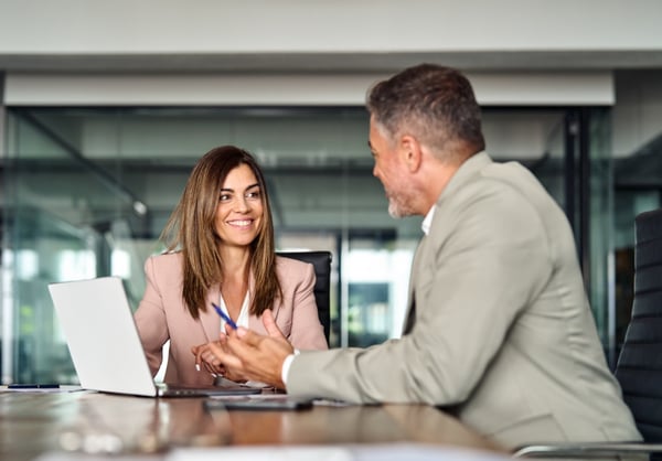 Man and woman meeting in office